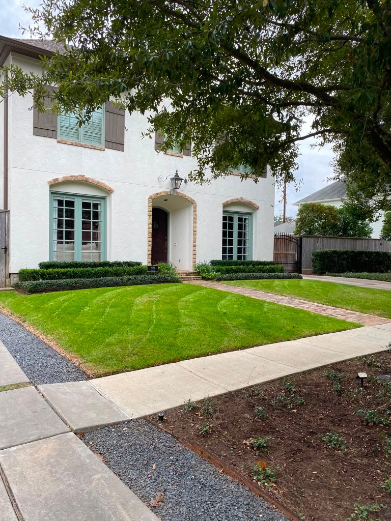 Freshly maintained lawn completed by Rainlandscaping